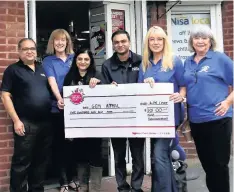  ??  ?? ●●Staff from Nisa on Shawclough Road present a cheque to Karen Johnson, Wendy Mills and Lynn Howles of GEM