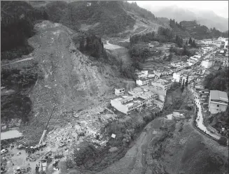  ?? PROVIDED TO CHINA DAILY ?? Rescuers work on the site of a landslide in Xuyong, Sichuan province, on Monday. The landslide occurred on Sunday afternoon, killing four people and injuring seven. One person remains missing.