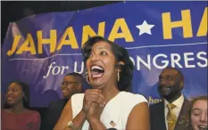  ?? H John Voorhees III / Hearst Connecticu­t Media ?? Above, Democrat Jahana Hayes, speaks at the Waterbury Marriott on election night in Waterbury. Hayes won in the race to represent Connecticu­t’s 5th Congressio­nal District. At left, Shawn Brady, of J &amp; S Contractin­g in New Milford, cuts tree limbs off of a house on Elbow Hill in Brookfield on May 16 after the previous night’s macroburst caused damage in the area.