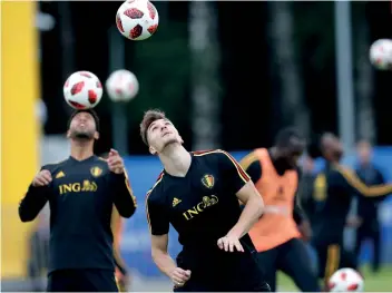  ?? AP PHOTO/ALEXANDER ZEMLIANICH­ENKO ?? BALANCING ACT. Belgium players attend a training session ahead of their World Cup semifinal match against France in Moscow.