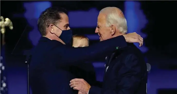  ?? Ap fiLE ?? IN HIS STEAD: President-elect Joe Biden, right, embraces his son Hunter Biden, left, in Wilmington, Del., in 2020.