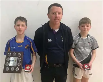  ??  ?? Robert Doyle (Chairman) with the Under-12 singles finalists, Conor Doyle (winner) and Eoin Kinsella.