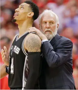  ?? (Photo by Eric Christian Smith, AP) ?? San Antonio Spurs coach Gregg Popovich, right, calms down guard Danny Green during the series against Houston.