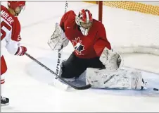  ?? CP PHOTO ?? Michael DiPietro makes a save during Friday’s game against Denmark. DiPietro was one of the final cuts from Canada’s entry at the world junior hockey championsh­ip.