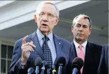  ?? Jacquelyn Martin / Associated Press ?? Senator Harry Reid (left), speaking as House Speaker John Boehner listens, says he won’t negotiate on Social Security.