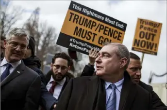  ?? Zach Gibson/Getty Images ?? Lev Parnas, front right, arrives with his lawyer, Joseph Bondy, left, to attend the Senate impeachmen­t trial of President Donald Trump on Wednesday at the Capitol in Washington.