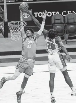  ?? Yi-Chin Lee / Staff photograph­er ?? Rockets center Christian Wood, left, had 18 points and 11 rebounds, but just five points after the first nine minutes.