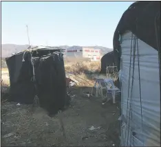  ??  ?? An outdoor toilet (left) is placed beside a dormitory for migrant workers.