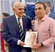  ??  ?? A file photo of Madhav Apte and Sunil Gavaskar.