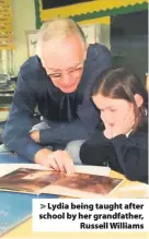  ??  ?? &gt; Lydia being taught after school by her grandfathe­r, Russell Williams