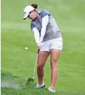  ?? PAUL VERNON/AP ?? Ally Ewing hits an approach shot on the fifth hole during the final round of the LPGA Tour Kroger Queen City on Sunday.