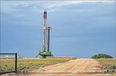  ?? [OKLAHOMAN ARCHIVES] ?? A rig operates at a drilling location in the STACK play of the Anadarko Basin in July 2018.