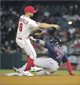  ?? Luis Sinco Los Angeles Times ?? CHRISTIAN VAZQUEZ is forced out at second, but Angels second baseman Jack Mayfield is late with his throw on a double-play attempt in the seventh inning.