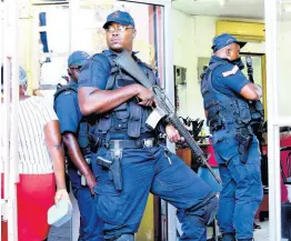  ?? HEMANS/PHOTOGRAPH­ER KENYON ?? As security forces take control of the market district in downtown Kingston, several vendors have expressed support for the move.