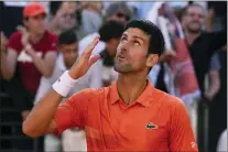  ?? ALESSANDRA TARANTINO — THE ASSOCIATED PRESS ?? Serbia’s Novak Djokovic celebrates after winning his final match against Greece’s Stefanos Tsitsipas at the Italian Open tennis tournament, in Rome Sunday.