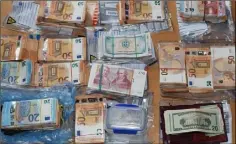  ??  ?? €135,000 in various currencies was recovered during the house search.