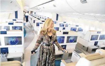  ?? CARLINE JEAN/STAFF PHOTOGRAPH­ER ?? Crystal Skye President and CEO Edie Rodriguez displays their luxury charter jet at Opa Locka Executive Airport.