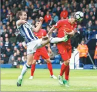  ?? ANDREW YATES / REUTERS ?? Roberto Firmino heads Liverpool in front during Sunday’s English Premier League match against West Bromwich Albion at The Hawthorns. Liverpool won 1-0.