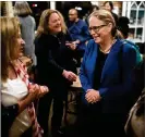  ?? BRANDEN CAMP/SPECIAL TO THE AJC ?? Democrat Carolyn Bourdeaux (right), with backer Beth Aronica on Tuesday at Farmhouse 17 in Norcross, is in a close race with Woodall.