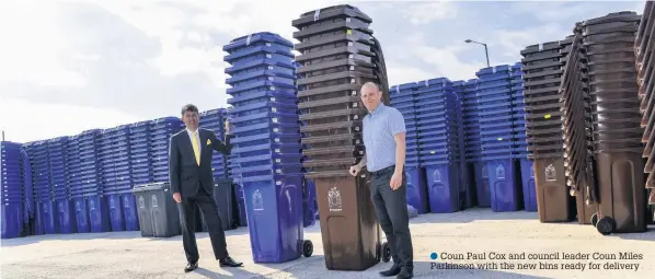  ??  ?? Coun Paul Cox and council leader Coun Miles Parkinson with the new bins ready for delivery