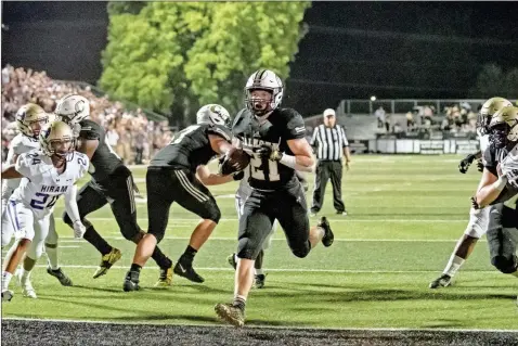  ?? Tim Godbee ?? Calhoun senior running back Caden Williams runs through a huge hole for a touchdown Friday against Hiram.