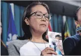  ?? JUSTIN TANG THE CANADIAN PRESS ?? Debbie Baptiste, mother of Colten Boushie, holds a photo of her son, who was fatally shot by a farmer in 2016.