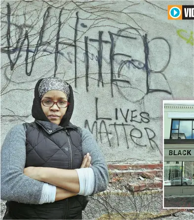  ??  ?? DISCOVERED DEFACEMENT: Kai Grant stands in front of graffiti reading ‘White Lives Matter’ on the exterior wall of Black Market Dudley yesterday. Grant is the coowner and chief curator of the pop-up market. STAFF PHOTOS BY PATRICK WHITTEMORE