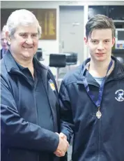  ??  ?? Rhys George of Neerim-Neerim South receives the Bill Cumming medal from EDFL board chair Roger Gwynne.