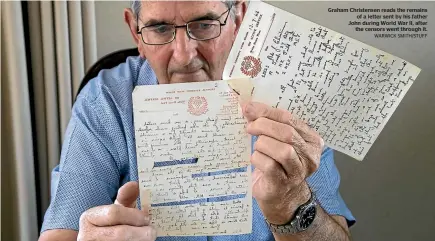  ?? WARWICK SMITH/STUFF ?? Graham Christense­n reads the remains of a letter sent by his father John during World War II, after the censors went through it.