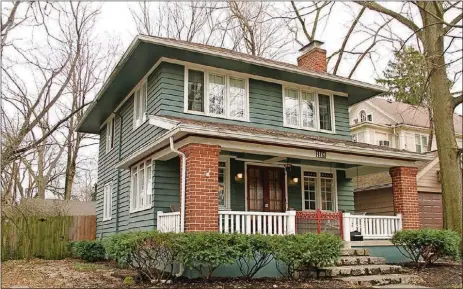  ?? CONTRIBUTE­D PHOTOS BY KATHY TYLER ?? The house has a front covered porch, fenced backyard and a 2-car, detached garage accessible from a cul-de-sac alley.