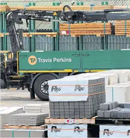  ?? Picture: PA. ?? A Travis Perkins lorry at one of the company’s yards.