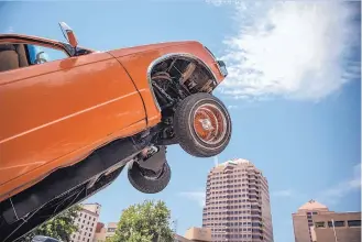  ?? ROBERTO E. ROSALES/JOURNAL ?? About a dozen lowrider car clubs rolled into Downtown on Saturday in support of former New Mexico governor Gary Johnson — the Libertaria­n Party nominee for president.