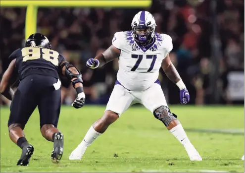  ?? Michael Conroy / Associated Press ?? TCU offensive tackle Lucas Niang plays against Purdue during the first half in 2019.