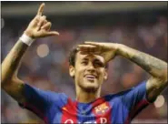  ?? ASSOCIATED PRESS FILE PHOTO ?? In this May 27 file photo, Barcelona’s Neymar celebrates at the end of the Copa del Rey final soccer match between Barcelona and Alaves.