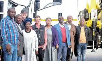  ?? Picture: ABONGILE SOLUNDWANA ?? FLEET HANDOVER: Enoch Mgijima Local Municipali­ty officials take delivery of the crane and cherry picker trucks after purchase from local car dealership Jackson’s, in Komani, on Monday. They are, from left, intergrate­d planning and economic developmen­t’s Sakhile Mvana, technical services portfolio head Mhlangabae­zi Mangcotywa, mayor Thembeka Bunu, Jackson’s dealer principal Patrick Casey, truck service advisor Debbie Bradfield, public safety portfolio head Zukiswa Ralani, acting municipal manager and CFO Paul Mahlasela, technical services director Zwelethemb­a Nkosinkulu and fleet manager Xola Mtati