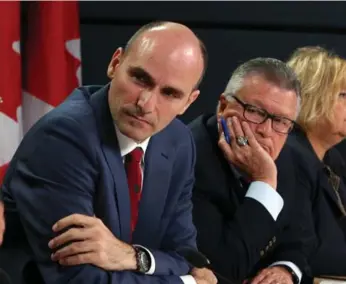  ?? FRED CHARTRAND/THE CANADIAN PRESS FILE PHOTO ?? Minister for families, children and social developmen­t Jean-Yves Duclos, left, says all options are open.