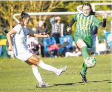  ?? APRIL GAMIZ/THE MORNING CALL ?? Emmaus’ Maddi Woodward, left, looks for control against Central Catholic’s Meredith Eisenmann during an EPC playoff game Monday in Allentown.