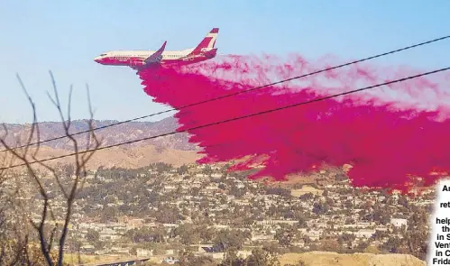  ??  ?? An Air Tanker drops fire retardant over lines while helping to fight the Maria Fire in Santa Paula, Ventura County in California on Friday.