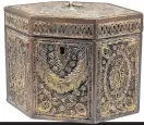  ??  ?? Left: Fine George
III tea caddy with extensive curled paper decoration, the quills gilded to give the impression of gold filigree. It sold for £500.
Photograph The Canterbury Auction Galleries