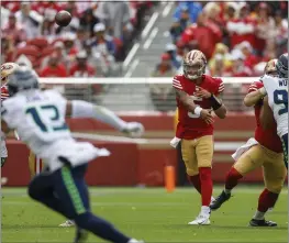  ?? NHAT V. MEYER — BAY AREA NEWS GROUP ?? San Francisco 49ers starting quarterbac­k Trey Lance (5) throws against the Seattle Seahawks in the first quarter at Levi’s Stadium in Santa Clara on Sept. 18, 2022.