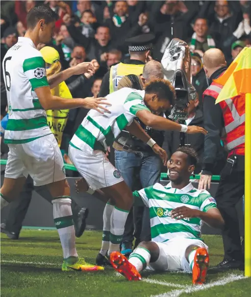 ?? Picture: GETTY IMAGES ?? THRILLS AND SPILLS: Celtic’s Moussa Dembele celebrates with teammates after scoring his team's third goal.