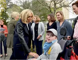 ?? — AFP ?? Brigitte Macron, the wife of the French President Emmanuel Macron, arrives to visit the Loisir pluriel center for both able-bodied and disabled children in Nantes, France, on Friday.