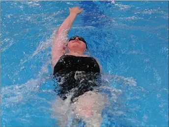  ?? Photos by Ernest A. Brown ?? Kaylie Beland, above, swims the backstroke in the 200-yard medley for Davies Tech, while Burrillvil­le’s Nikki DeFelice, below, competes in the breakstrok­e in the Broncos’ 52-19 defeat to the Patriots.