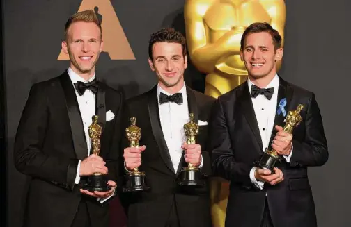  ?? Ian West - PA Images/PA Images via Getty Images ?? Justin Hurwitz, Benj Pasek and Justin Paul with the award for Best Original Song for “City of Stars” from “La La Land” in the press room at the 89th Academy Awards held at the Dolby Theatre in Hollywood, Calif.