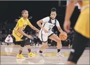  ?? Jason Armond Los Angeles Times ?? JUJU WATKINS of Sierra Canyon brings the ball up court during her 39-point game at Staples Center.