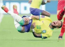  ?? — Reuters ?? Brazil’s Neymar reacts after a challenge from Serbia’a Sasa Lukic.