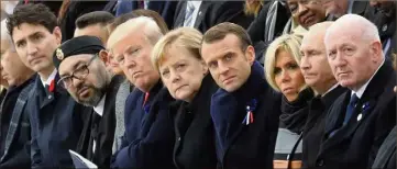  ??  ?? Justin Trudeau, le roi Mohamed VI, Donald Trump, la chancelièr­e allemande Angela Merkel, Emmanuel Macron et son épouse, le président russe Vladimir Poutine et l’Australien Peter Cosgrove. (Photo AFP)