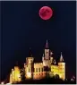  ?? MATTHIAS HANGST / GETTY IMAGES ?? A blood moon rises behind The Hohenzolle­rn Castle in Hechingen, Germany, on Friday.