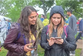  ?? CAMILLA CEREA/AUDUBON SOCIETY ?? Elizabeth Sorrell, right, shown at a March for Science last year in Washington, D.C., says she is treading lightly on the environmen­t this holiday season by primarily giving away experience­s.