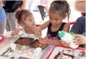  ?? MAYA PAZOS, CITY OF GLENDALE ?? Kids make chocolate pizzas at the Cerreta’s booth in Murphy Park during the 2018 Glendale Chocolate Affaire.